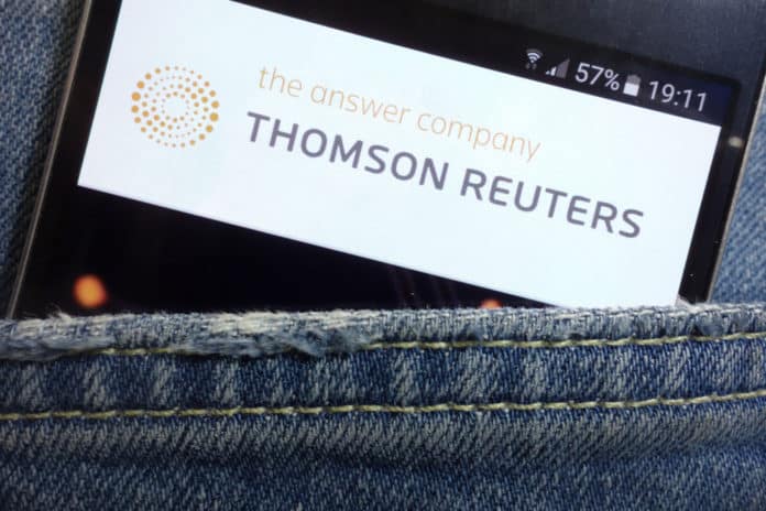 KONSKIE, POLAND - MAY 17, 2018 Thomson Reuters website displayed on smartphone hidden in jeans pocket. Source: shutterstock.com
