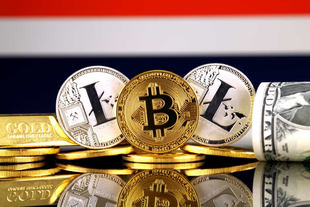 Physical version of Bitcoin, Litecoin, gold, US Dollar and Thailand Flag. Source: Shutterstock.com