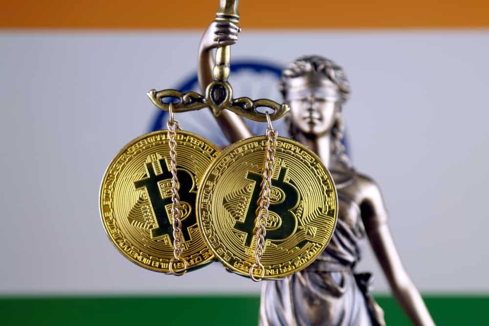 Symbol of law and justice, physical version of Bitcoin and India Flag. Source: Shutterstock.com