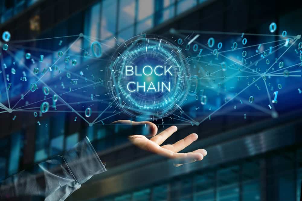 View of a Blockchain title with 0 and 1 data flying over. Source: Shutterstock.com