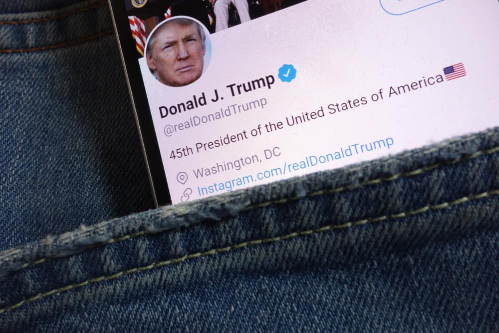 KONSKIE, POLAND - JUNE 01, 2018: Twitter page for Donald Trump displayed on smartphone hidden in jeans pocket. Source: shutterstock.com
