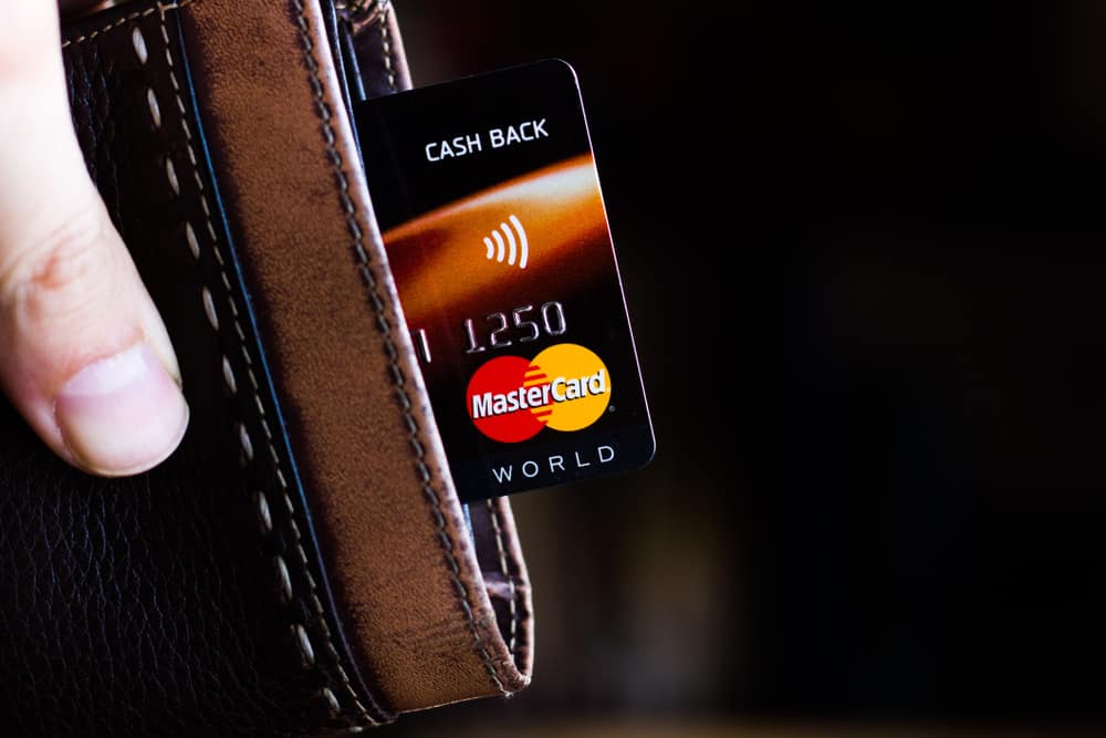 Ryazan, Russia - February 27, 2018: Credit or debit card of Mastercard brand in a leather wallet. Source; shutterstock.com