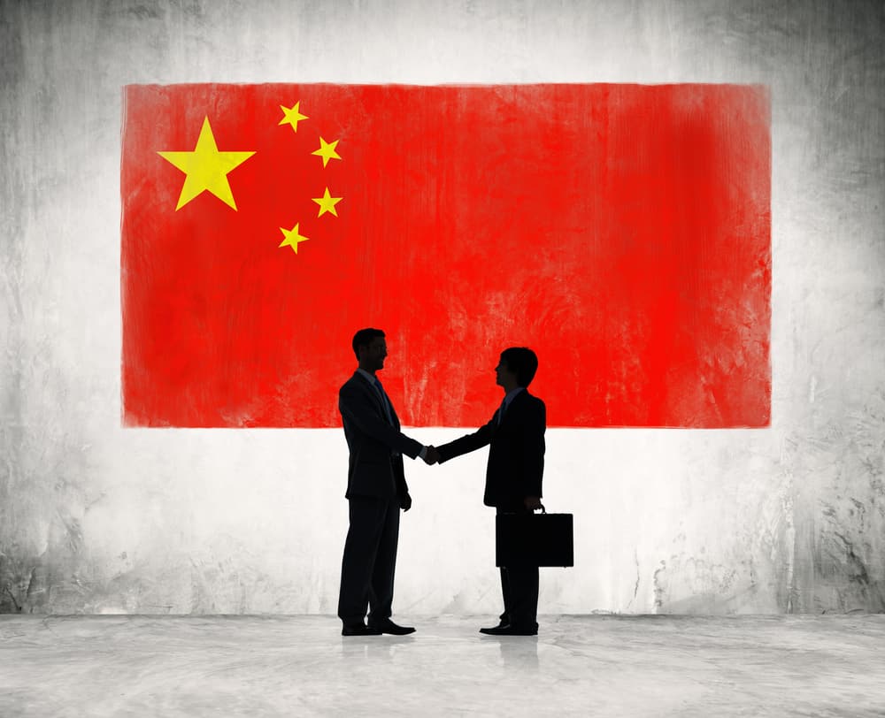 Partnership concept with Chinese flag on background