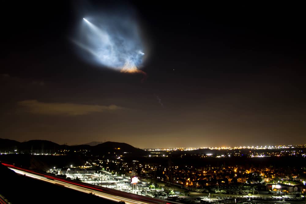 Grand Terrace, CA USA - October 7, 2018 The first and second stage separation of a SpaceX Falcon 9 rocket launched from Vandenberg Air Force Base is illuminated just after sunset.