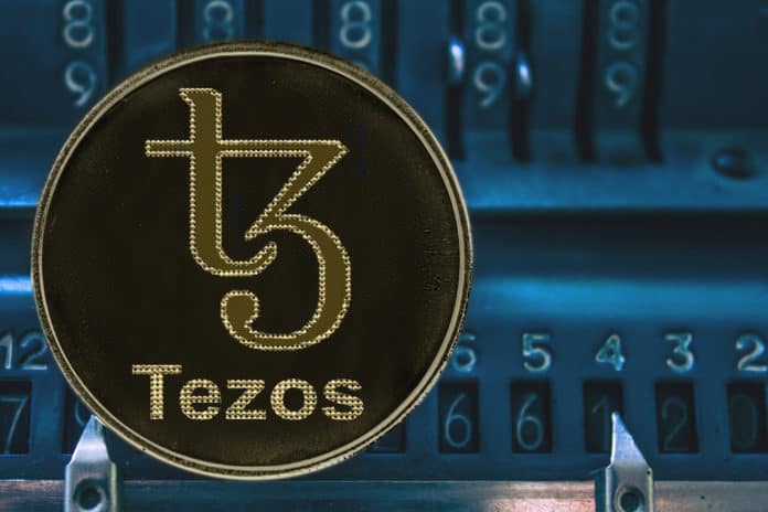Coin cryptocurrency Tezos and the numbers of the arithmometer. The concept of XTZ. - Image